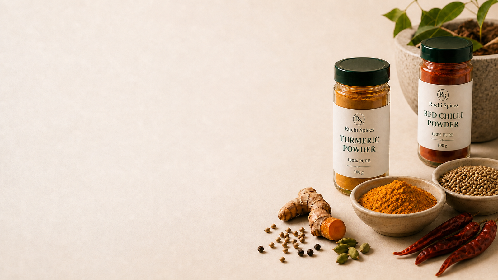 Turmeric and chilli jars arranged with freshly ground and whole Indian spices